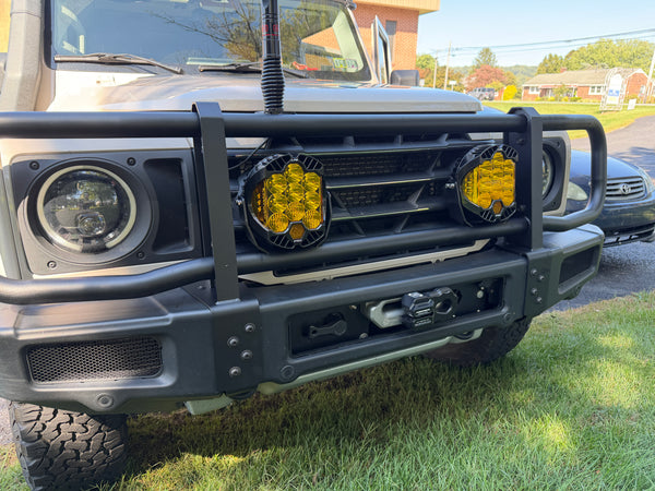 Front view of a vehicle with additional lights mounted on the bumper